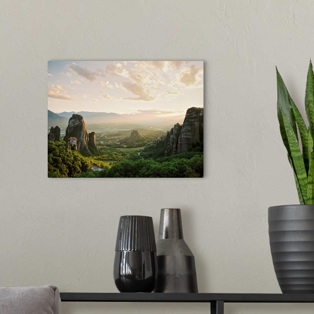 A modern room featuring Photograph of ancient monoliths in the landscape, Meteora, Greece.