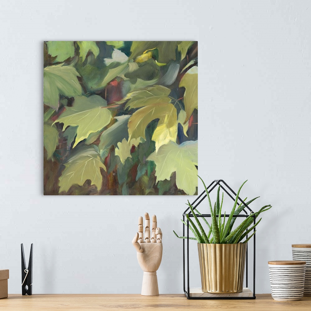 A bohemian room featuring Contemporary artwork of green oak leaves in the shade.