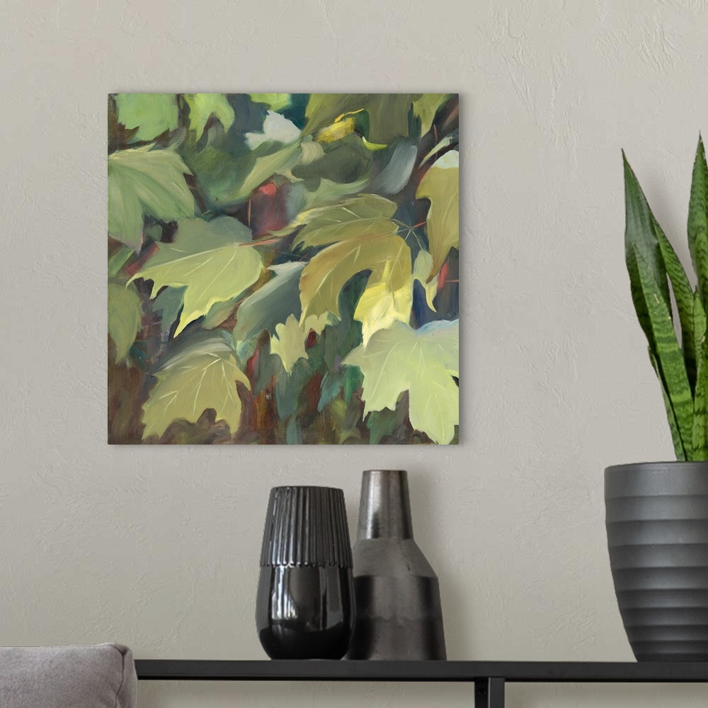 A modern room featuring Contemporary artwork of green oak leaves in the shade.