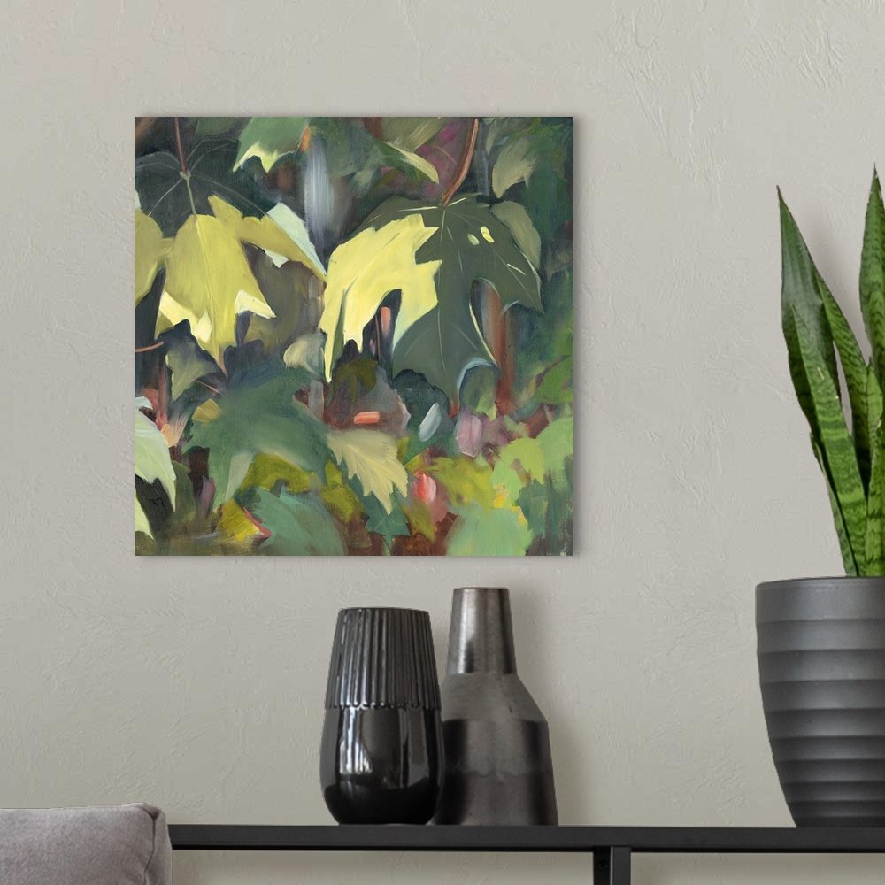 A modern room featuring Contemporary artwork of green oak leaves in the shade.