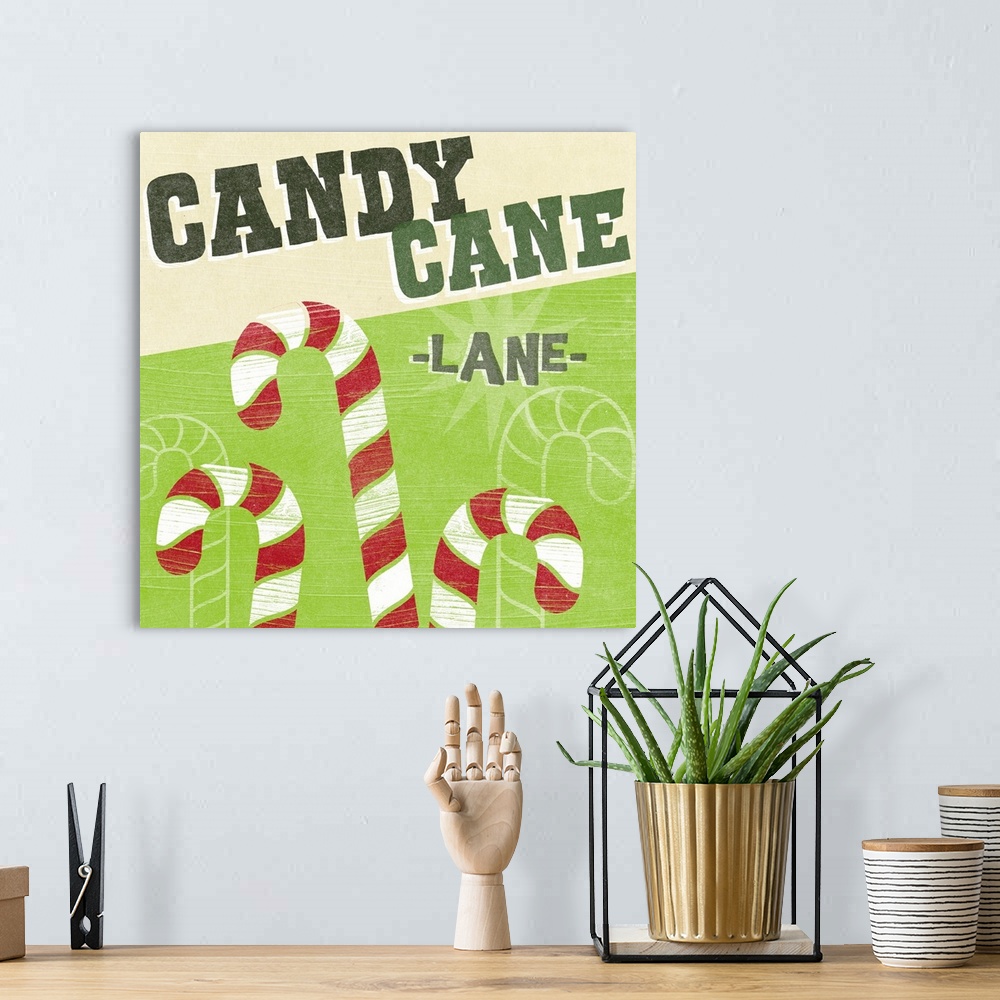 A bohemian room featuring "Candy Cane Lane" above candy canes against a lime green backdrop and overlapping thin white line...