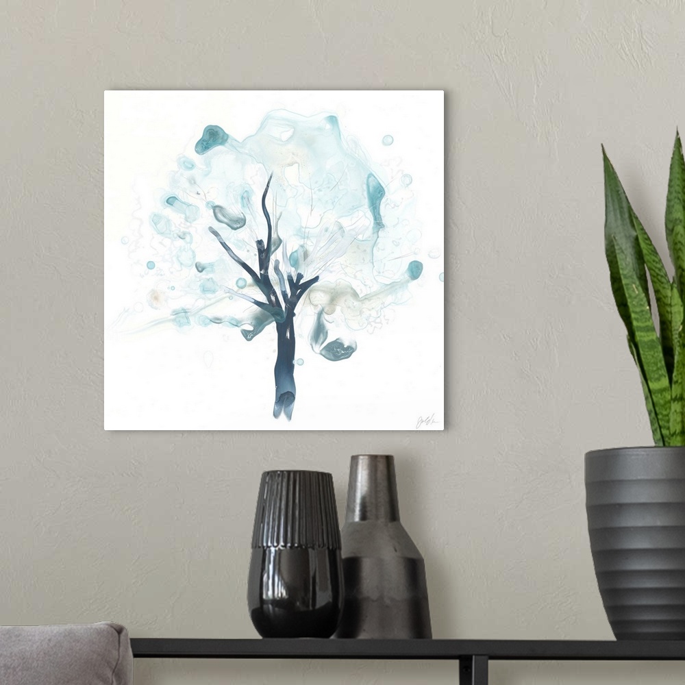A modern room featuring Watercolor painting of a tree in watered down blue shades with blurred spots.