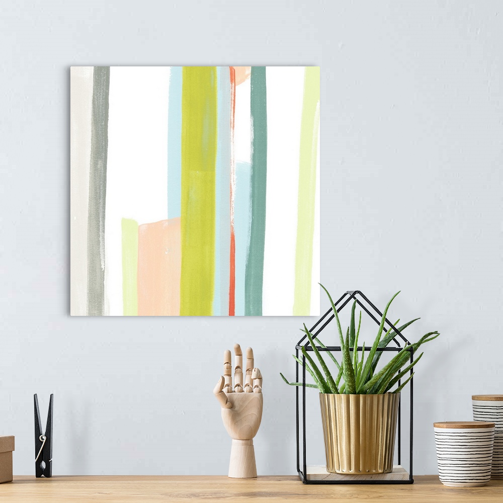 A bohemian room featuring Pastel abstract painting of vertical stripes in blue, yellow, and peach.