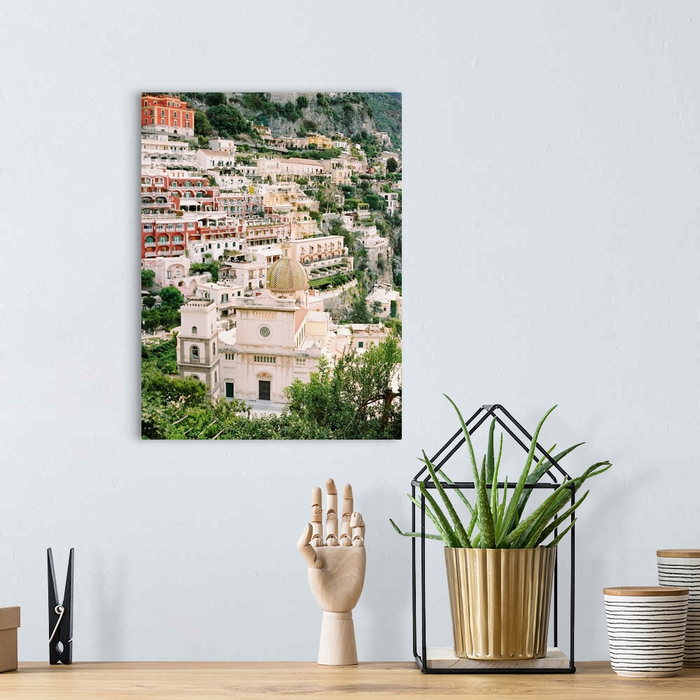 A bohemian room featuring Photograph of the houses and buildings of Positano, Italy perched on the steep hillside.