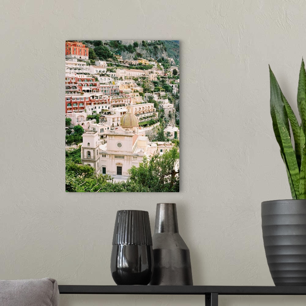 A modern room featuring Photograph of the houses and buildings of Positano, Italy perched on the steep hillside.