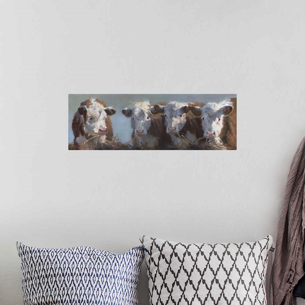 A bohemian room featuring Contemporary painting of a bull and three cows eating hay.