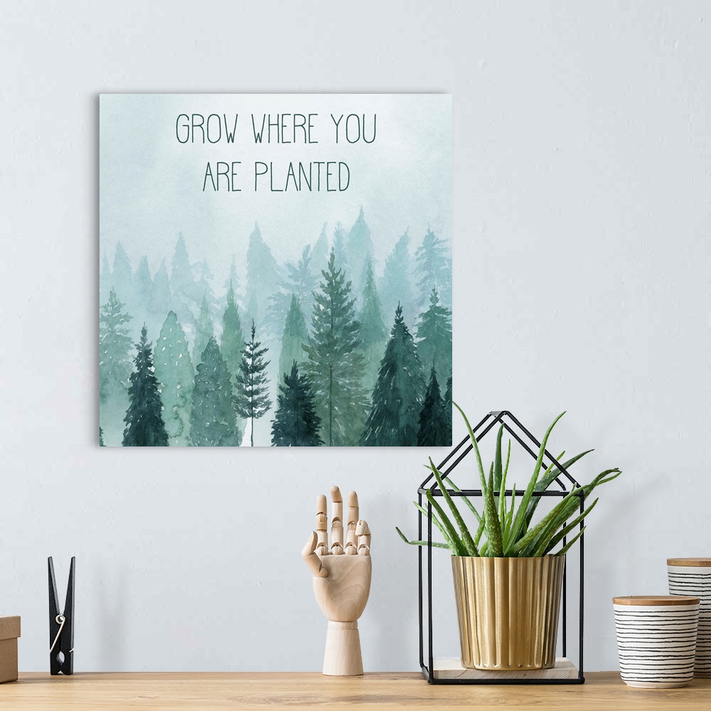A bohemian room featuring Decorative artwork of watercolor trees on a foggy day with the words: Grow where you are planted.