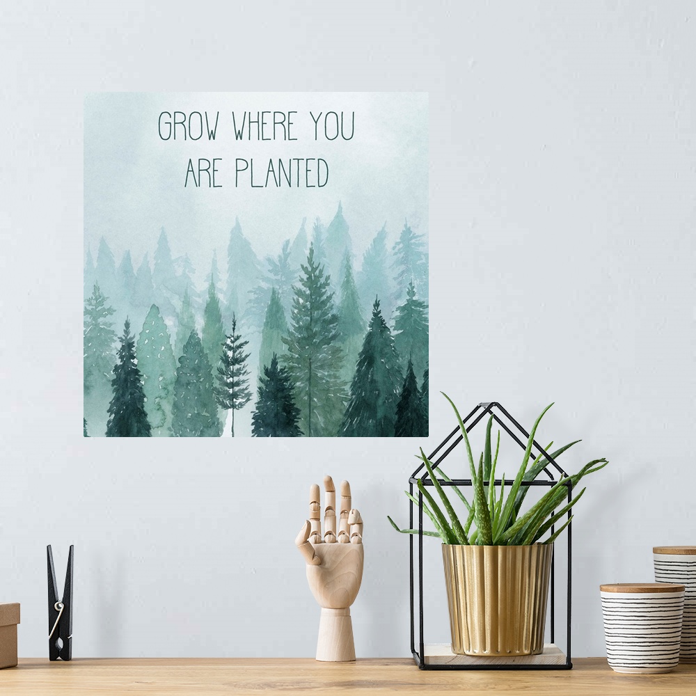 A bohemian room featuring Decorative artwork of watercolor trees on a foggy day with the words: Grow where you are planted.