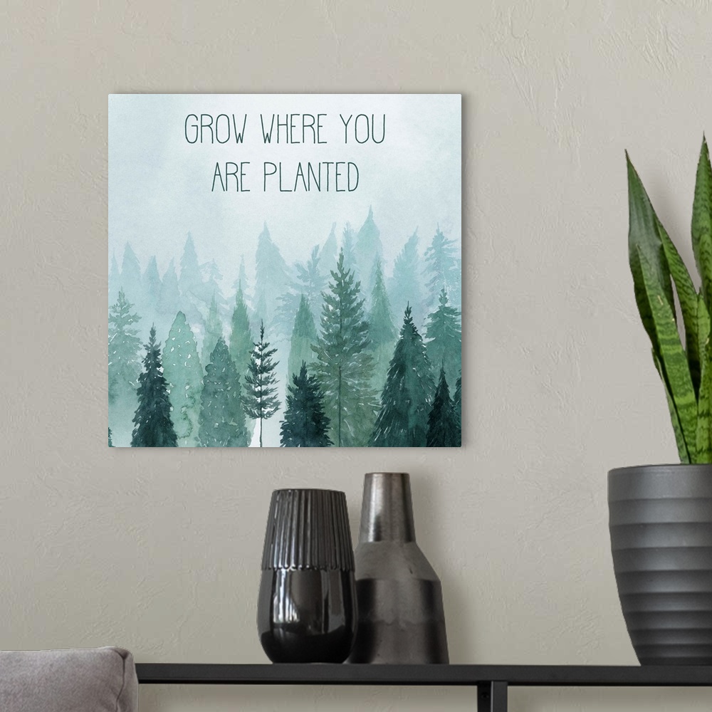 A modern room featuring Decorative artwork of watercolor trees on a foggy day with the words: Grow where you are planted.
