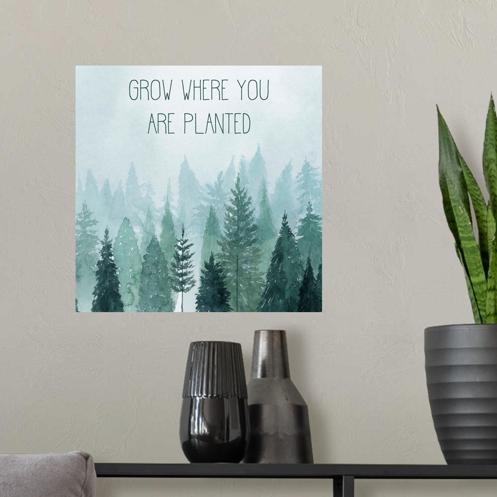 A modern room featuring Decorative artwork of watercolor trees on a foggy day with the words: Grow where you are planted.