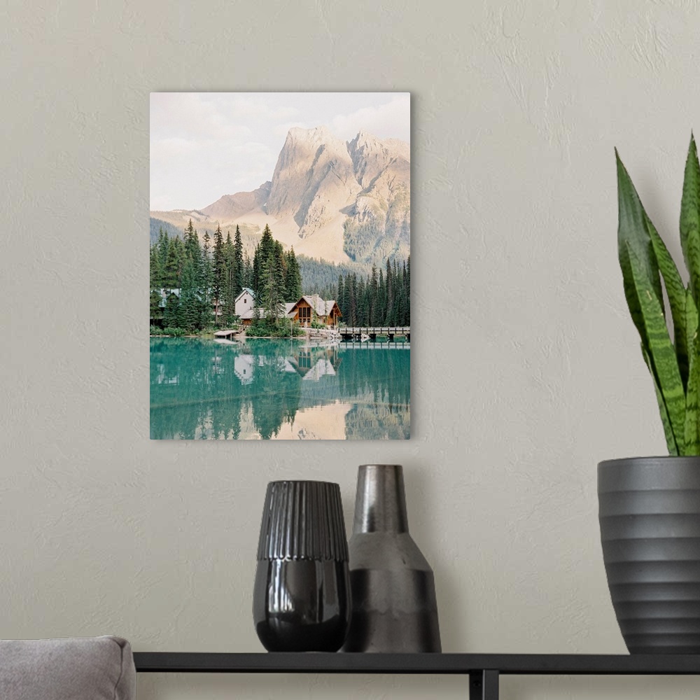 A modern room featuring Photograph of Emerald Lake Lodge and surrounding trees reflected in Moraine Lake, Banff, Canada.