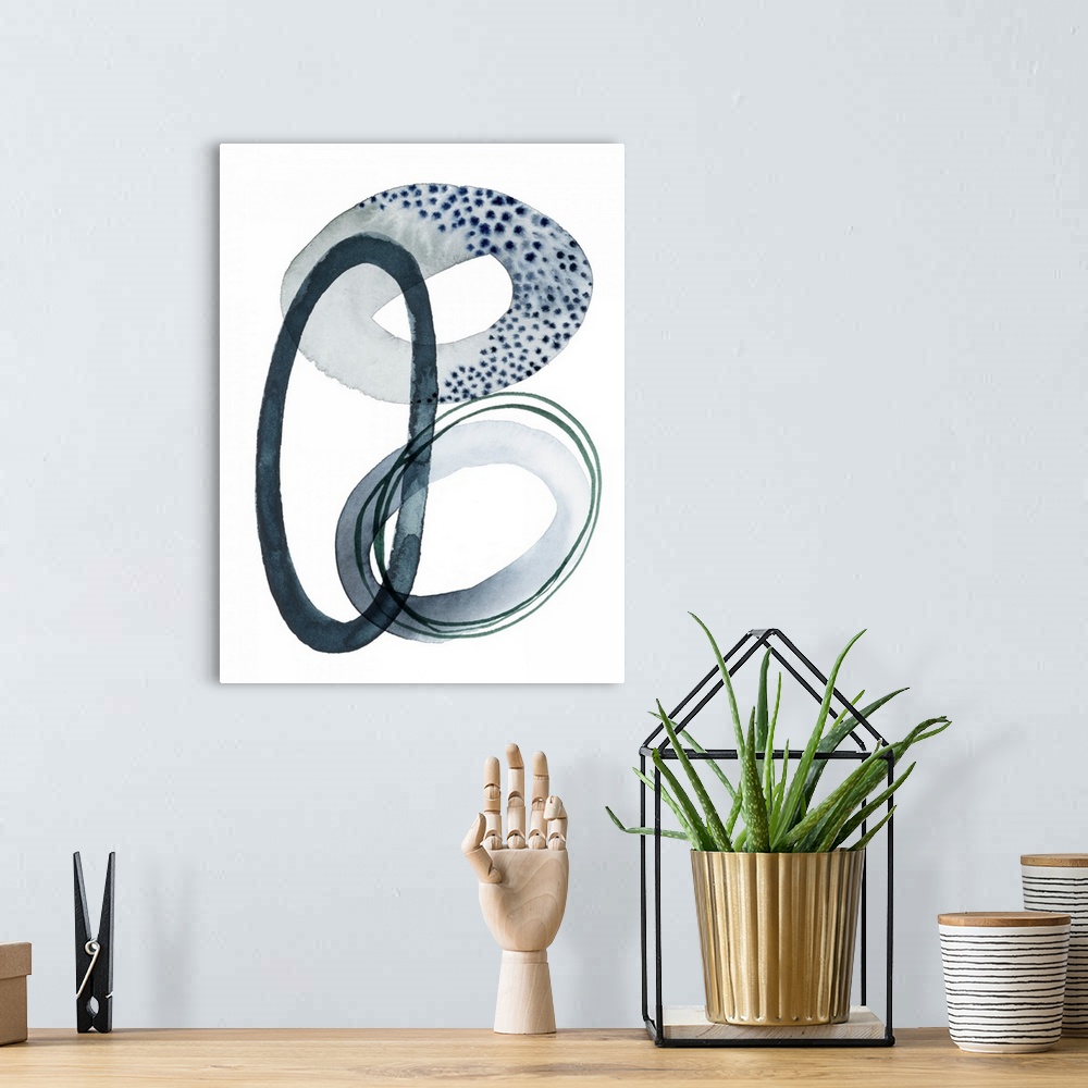 A bohemian room featuring A series of interlocking watercolor rings in varying thickness and textures overlap a white backg...