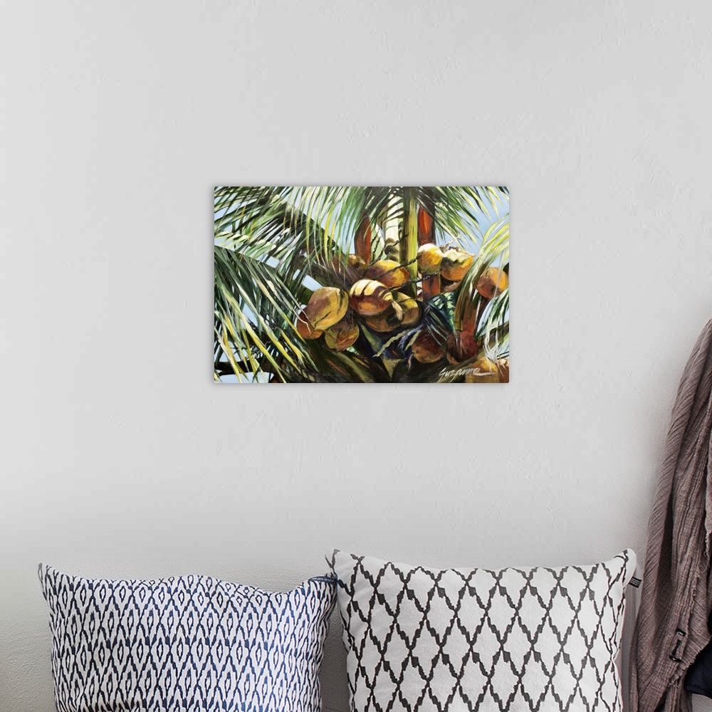 A bohemian room featuring A painting of a group of coconuts on a palm tree.