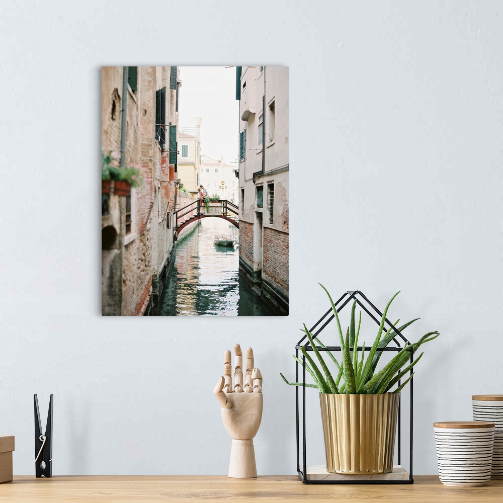 A bohemian room featuring Photograph of a couple kissing on a bridge over a canal, Venice, Italy.