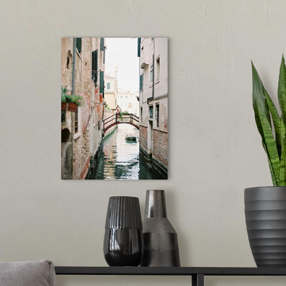 A modern room featuring Photograph of a couple kissing on a bridge over a canal, Venice, Italy.