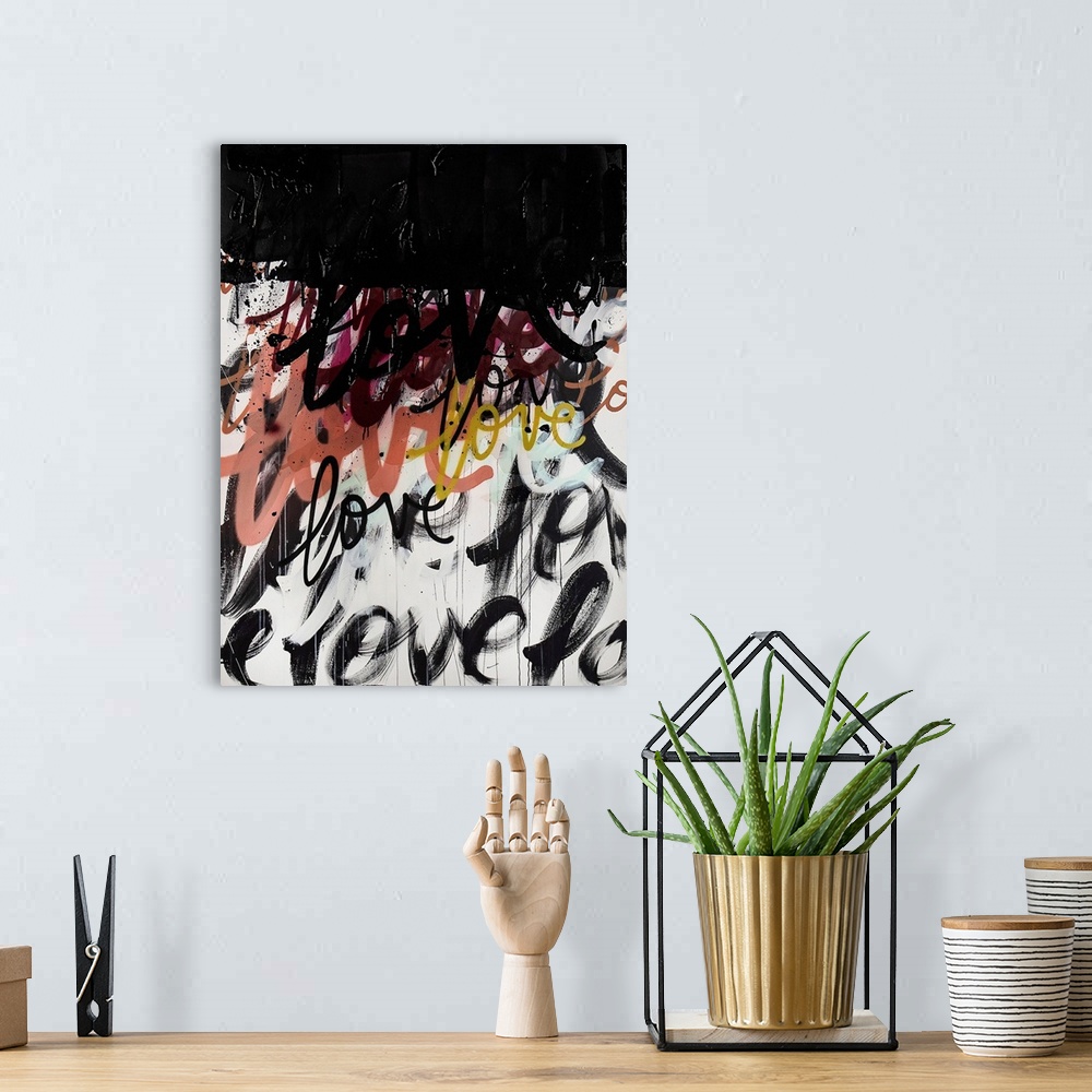 A bohemian room featuring A powerful statement piece of contemporary art featuring the word love in a handwritten font on a...