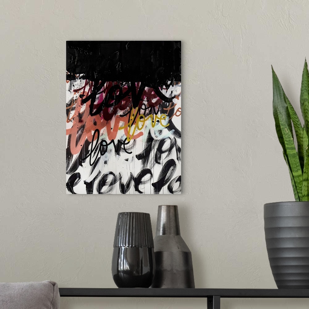 A modern room featuring A powerful statement piece of contemporary art featuring the word love in a handwritten font on a...