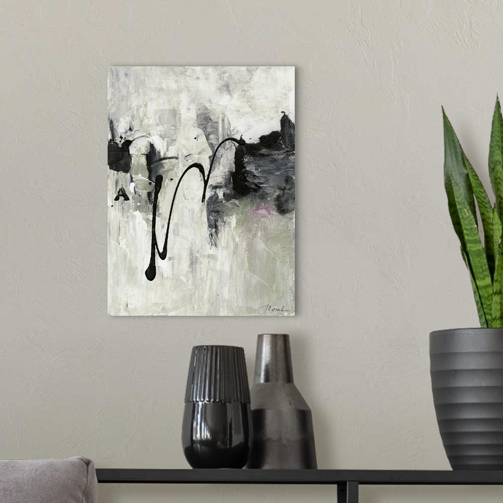 A modern room featuring Abstract art in neutral grey shades with deep black splatters.