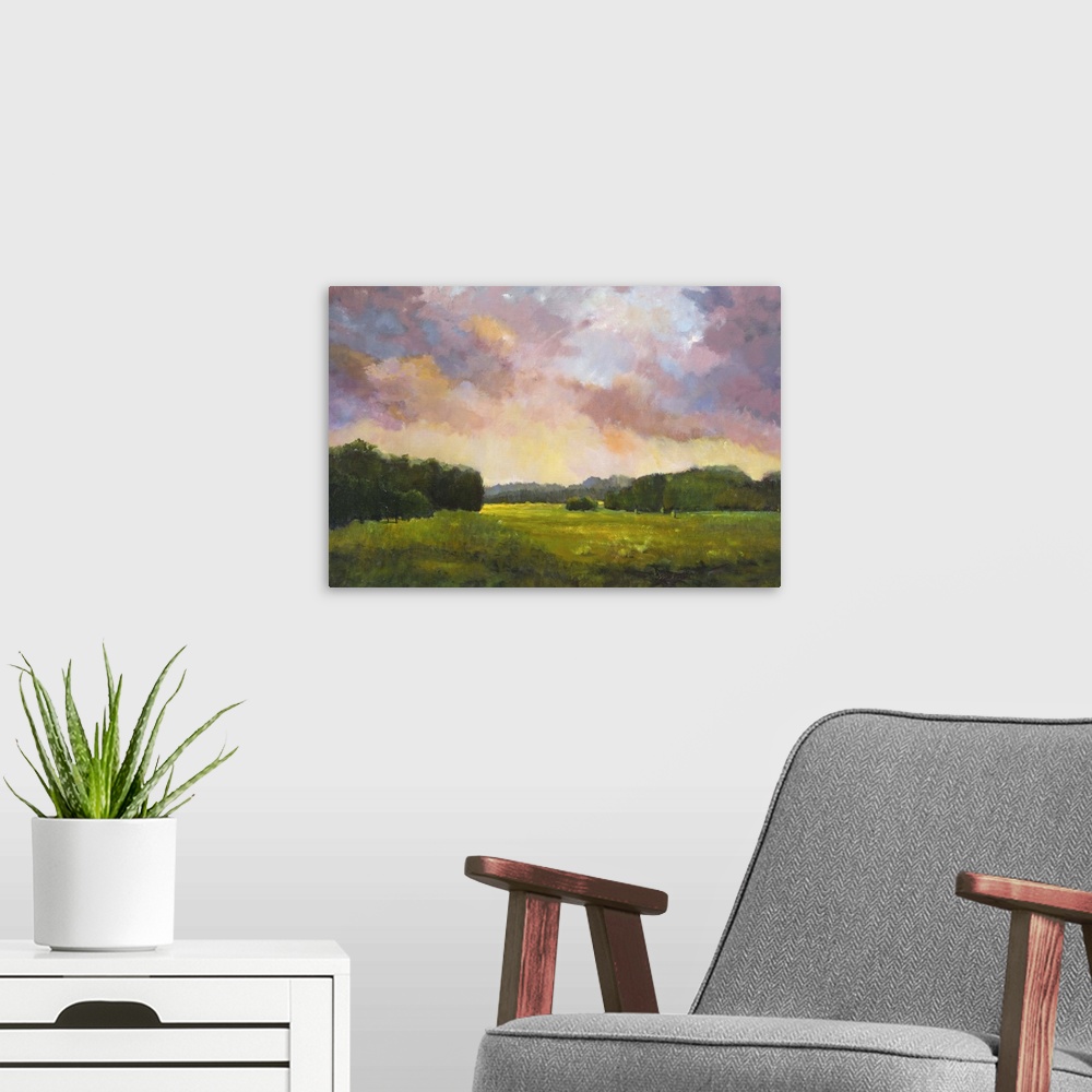 A modern room featuring Contemporary painting of a countryside landscape at sunset.