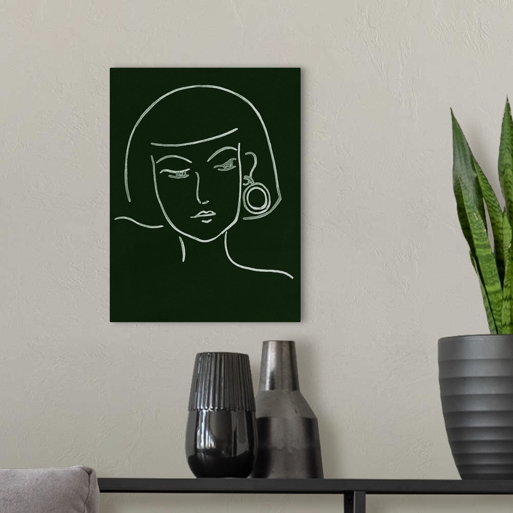A modern room featuring Portrait outline of a woman wearing a fashionable earring on a dark green background.