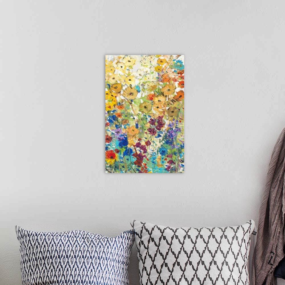 A bohemian room featuring Contemporary artwork of a cheerful field of rainbow colored flowers in full bloom.