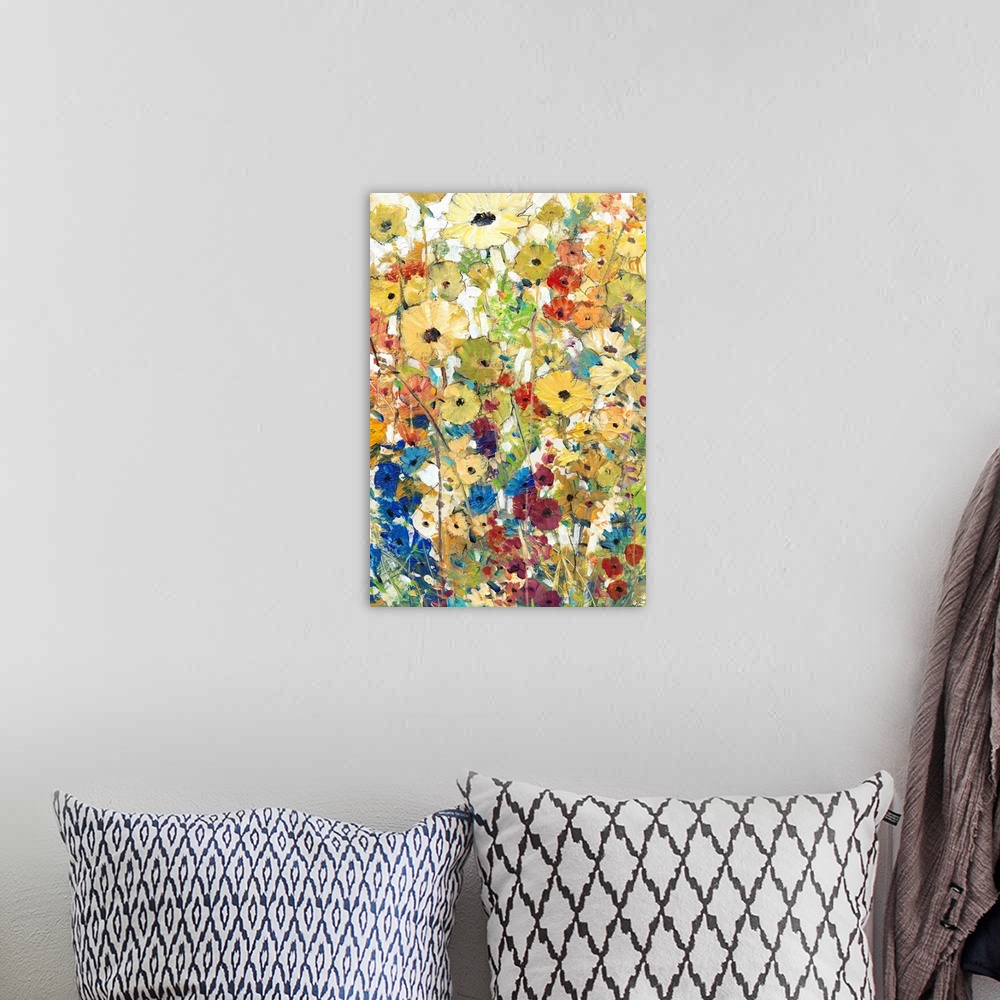 A bohemian room featuring Contemporary artwork of a cheerful field of rainbow colored flowers in full bloom.