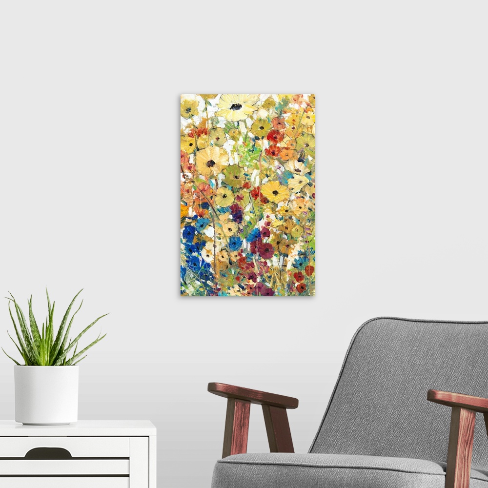 A modern room featuring Contemporary artwork of a cheerful field of rainbow colored flowers in full bloom.