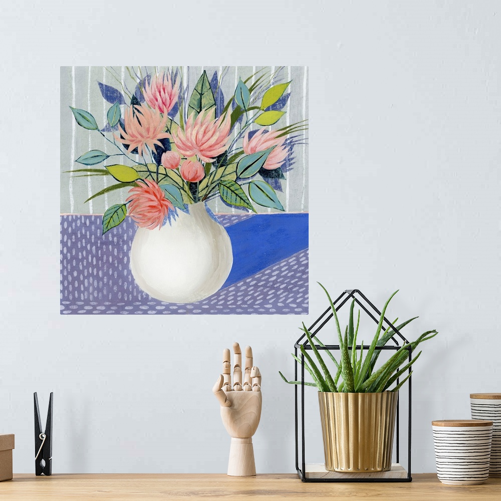 A bohemian room featuring Mod artwork of pink flowers blooming in a white round vase.