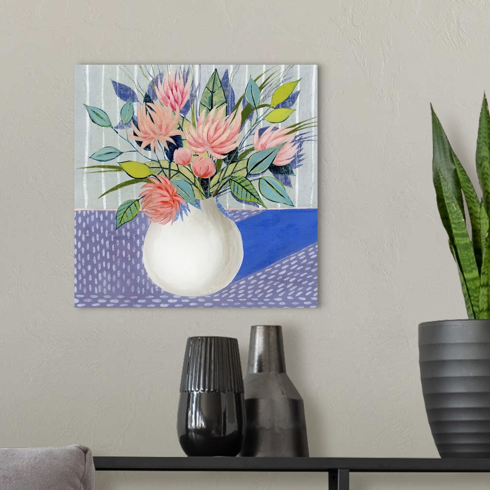 A modern room featuring Mod artwork of pink flowers blooming in a white round vase.