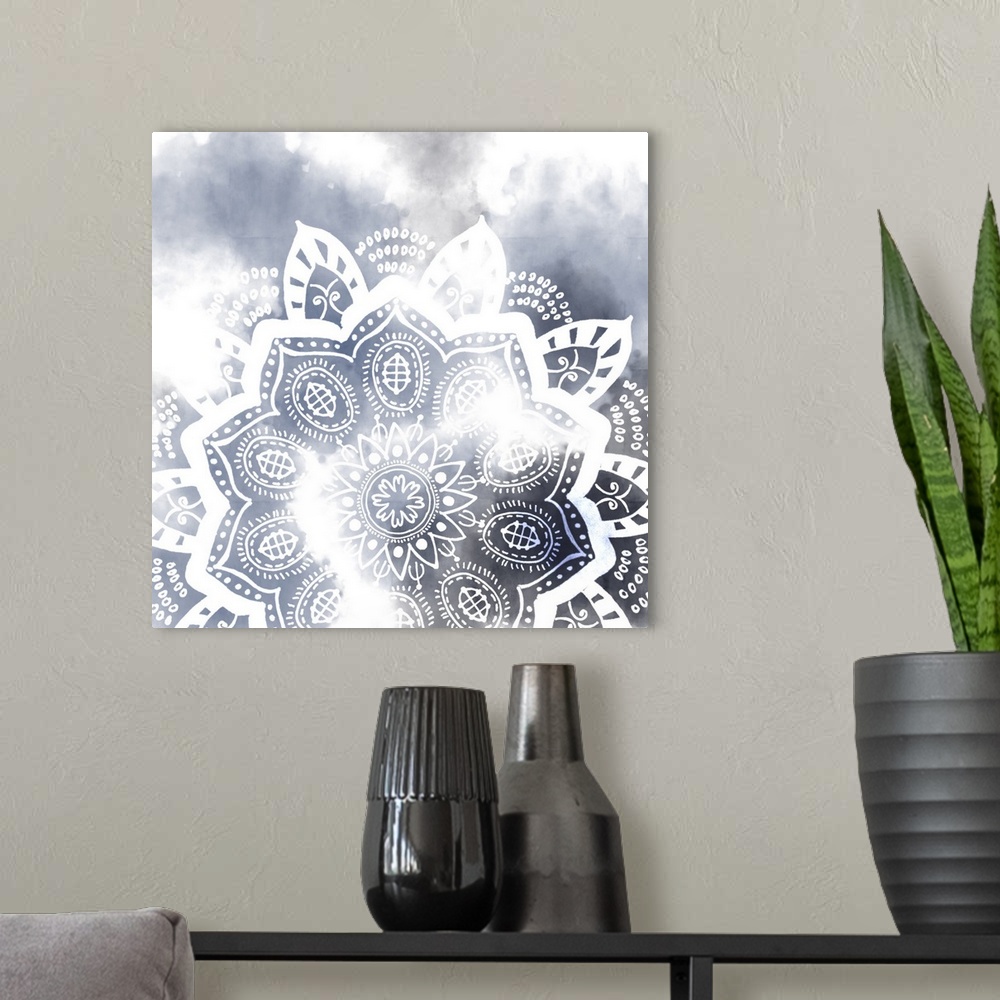 A modern room featuring Decorative image of a mandala pattern in white over dark blue, fading into white.
