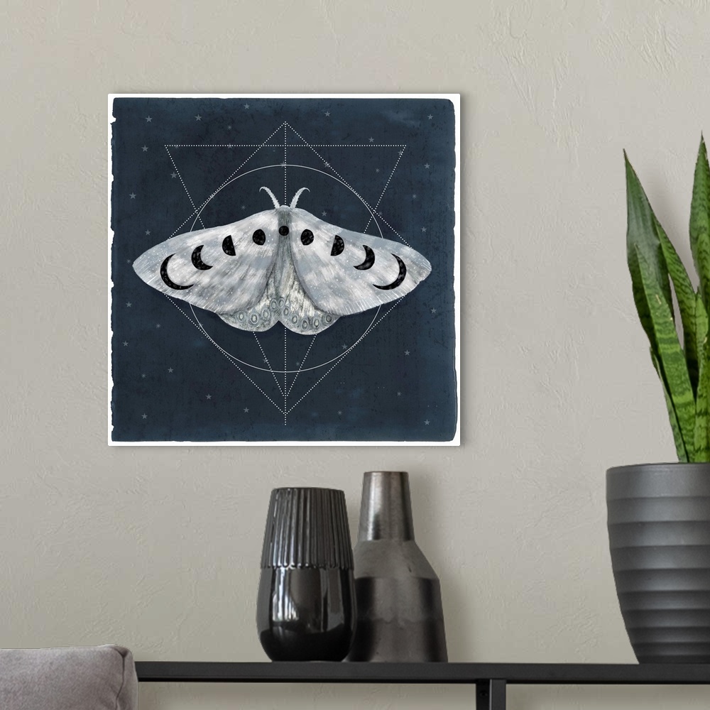A modern room featuring Watercolor moth with moon shapes on its wings in front of geometric shapes on a navy background.