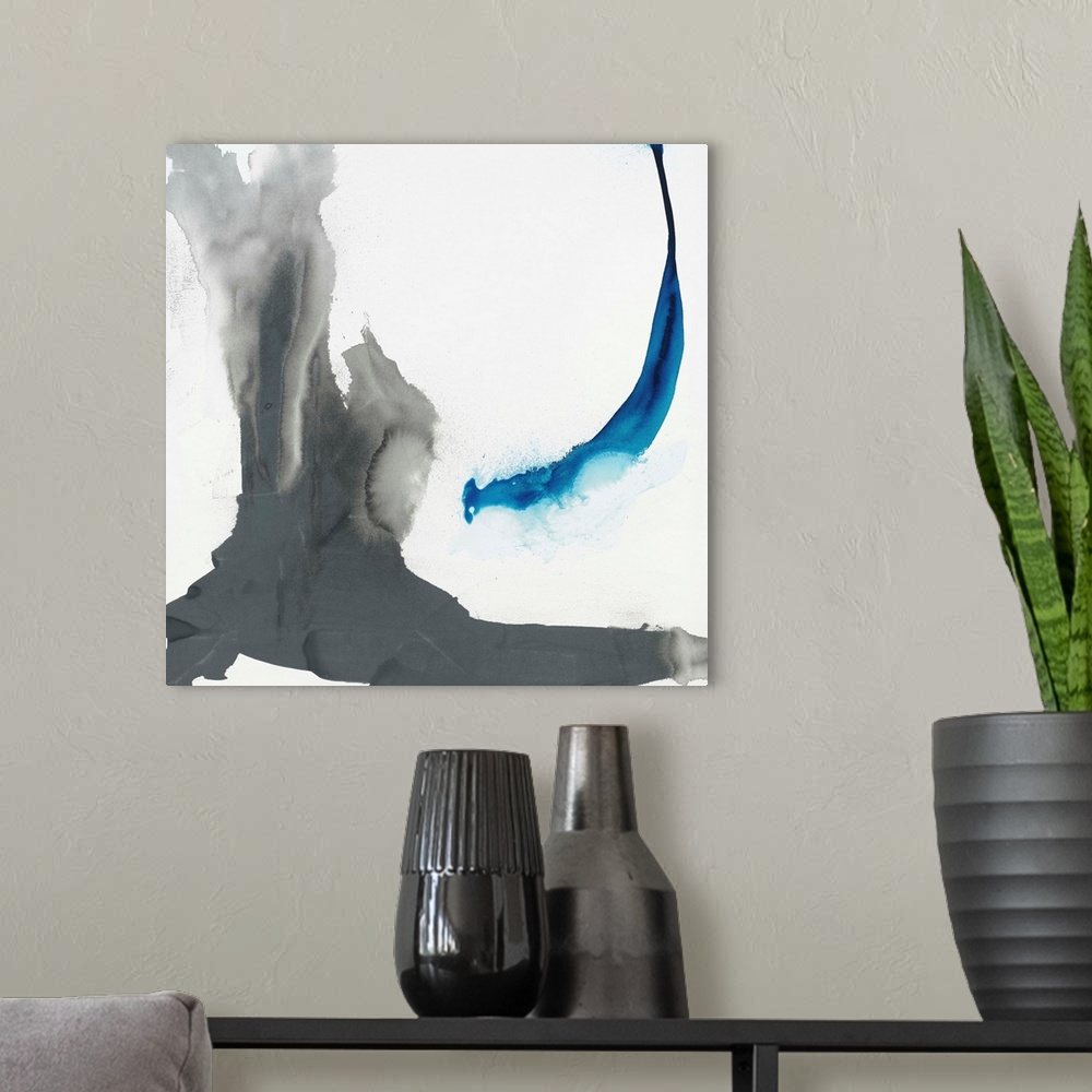 A modern room featuring Abstract painting using aggressive strokes of gray with a hint of blue against a white background.