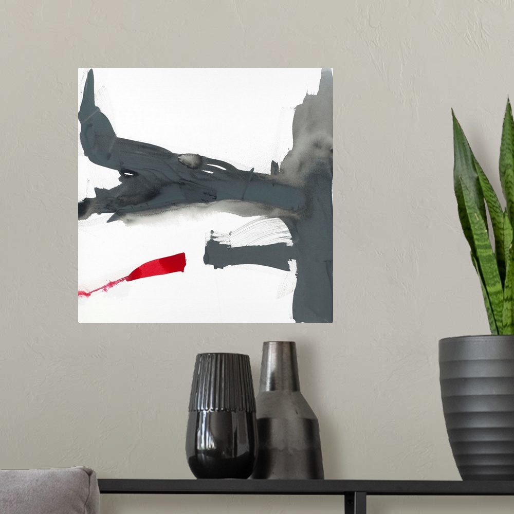A modern room featuring Abstract painting using aggressive strokes of gray with a hint of red against a white background.