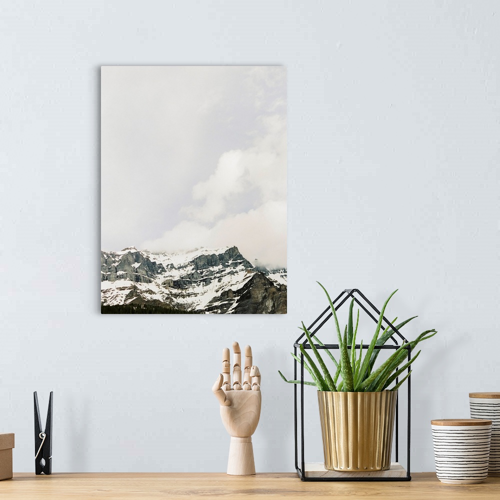 A bohemian room featuring Photograph of craggy mountains under a cloudy sky, Banff, Canada