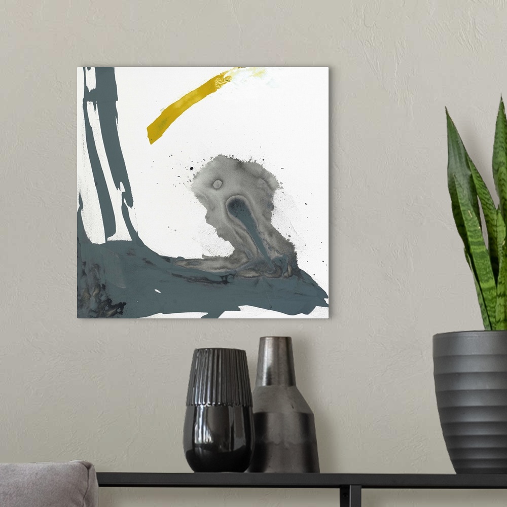 A modern room featuring Abstract painting using aggressive strokes of gray with a hint of yellow against a white background.