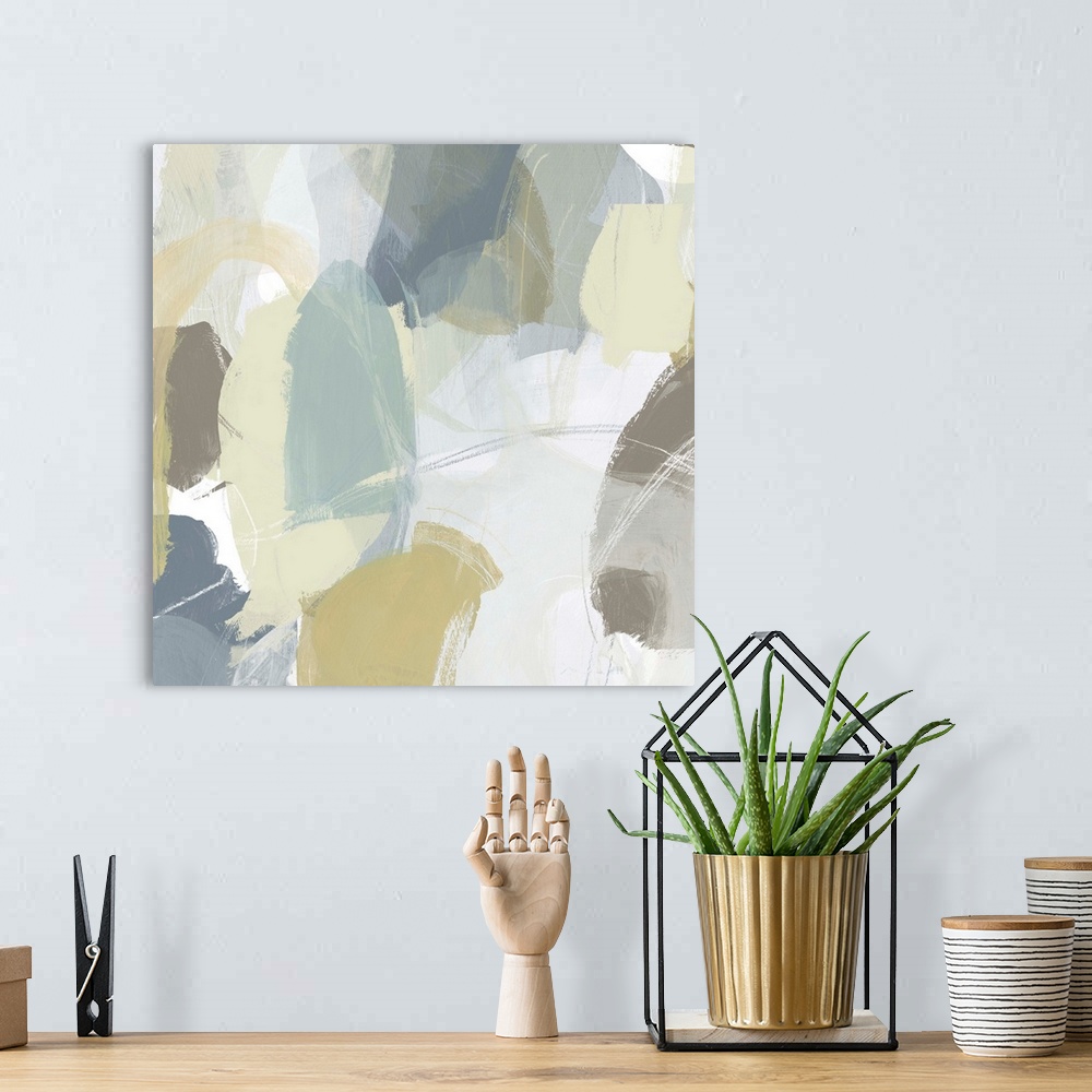A bohemian room featuring Contemporary abstract painting using muted blue, green and tan tones.