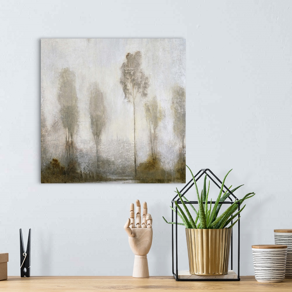 A bohemian room featuring A contemporary painting of a fog shrouded group of tall thin trees.