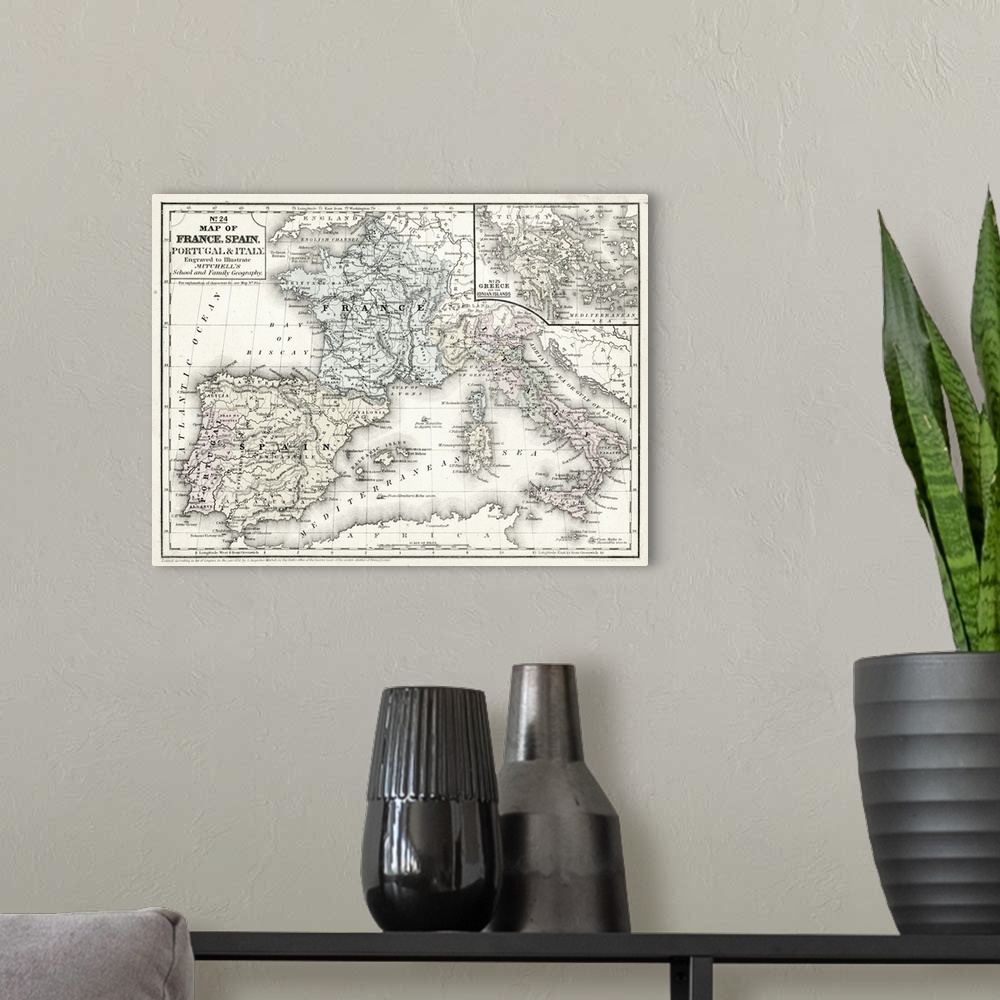 A modern room featuring Mitchell's Map of France, Spain and Italy