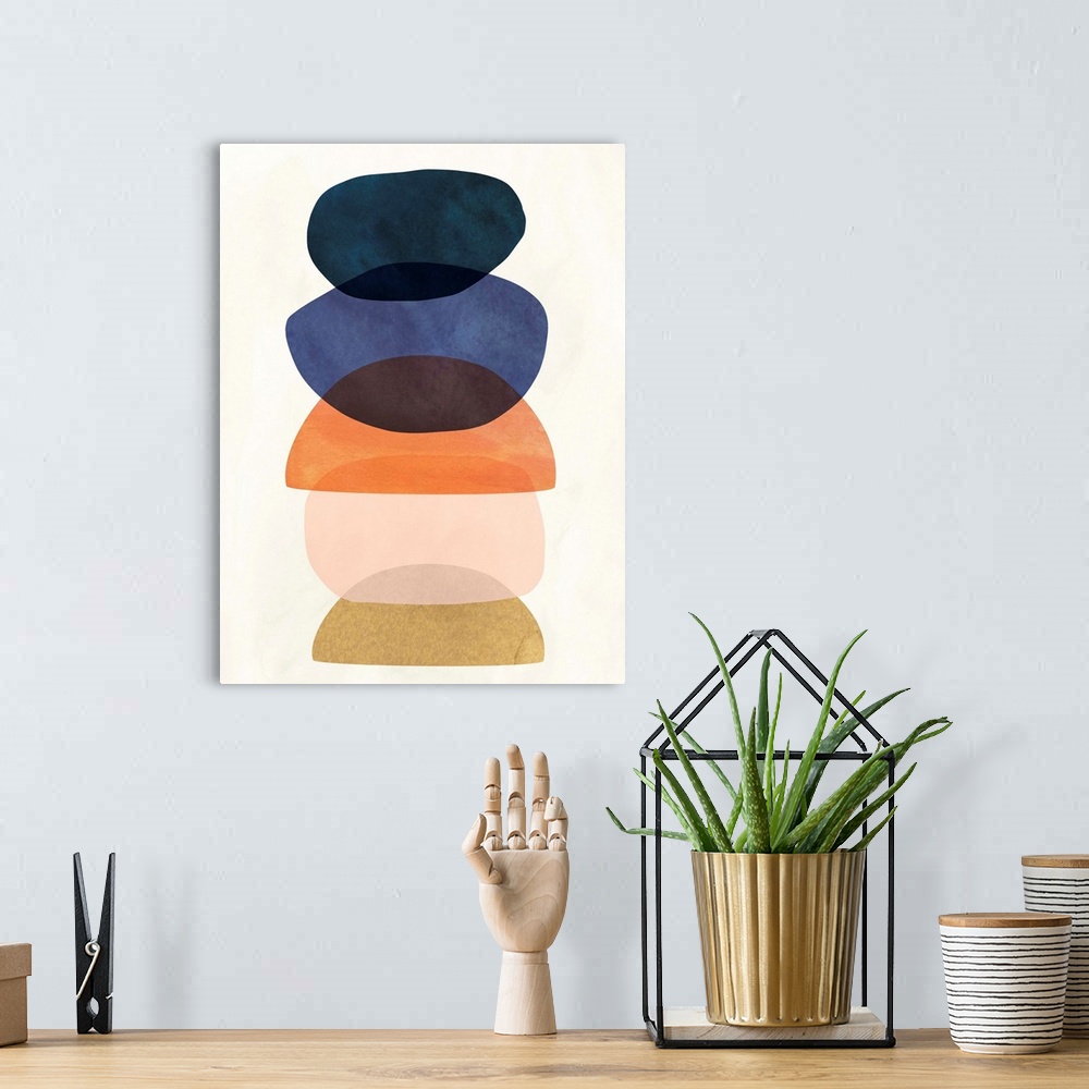 A bohemian room featuring Mid-century modern style abstract painting with multi-colored overlapping shapes.