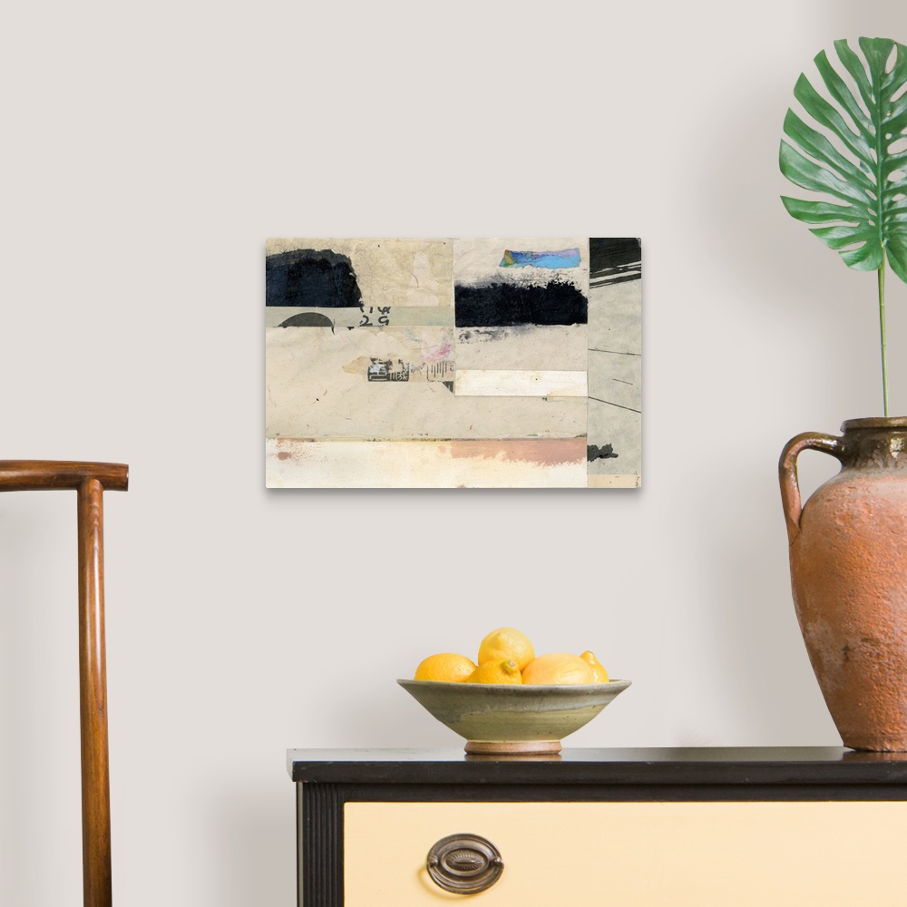 A traditional room featuring Contemporary abstract artwork using collage style news print clippings and strokes of paint in th...