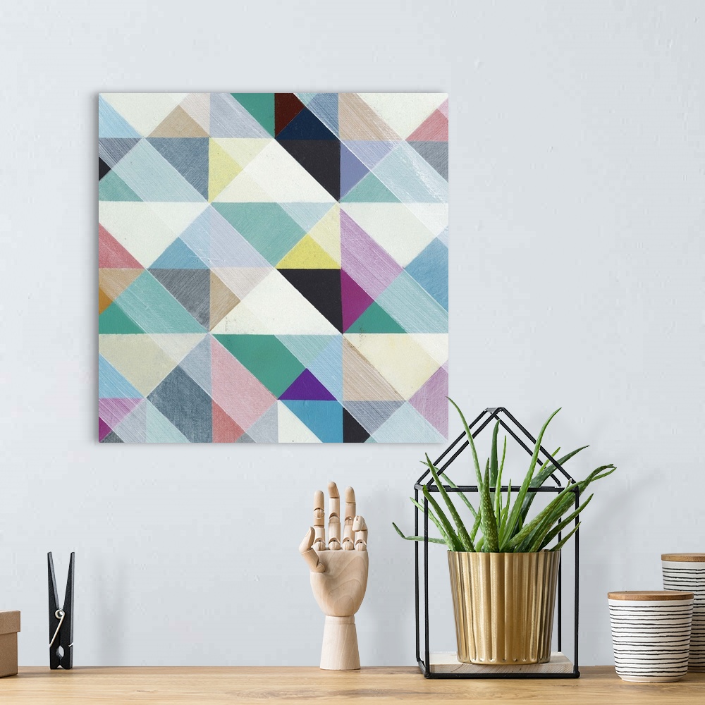 A bohemian room featuring Contemporary colorful patterned artwork using geometric shapes.