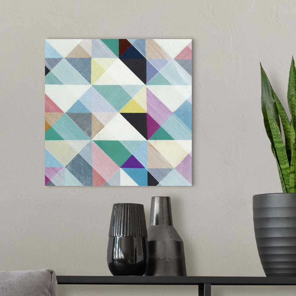 A modern room featuring Contemporary colorful patterned artwork using geometric shapes.