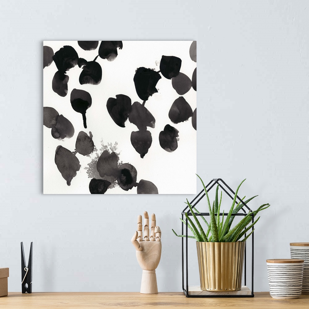 A bohemian room featuring Abstract contemporary artwork in stark black and white.