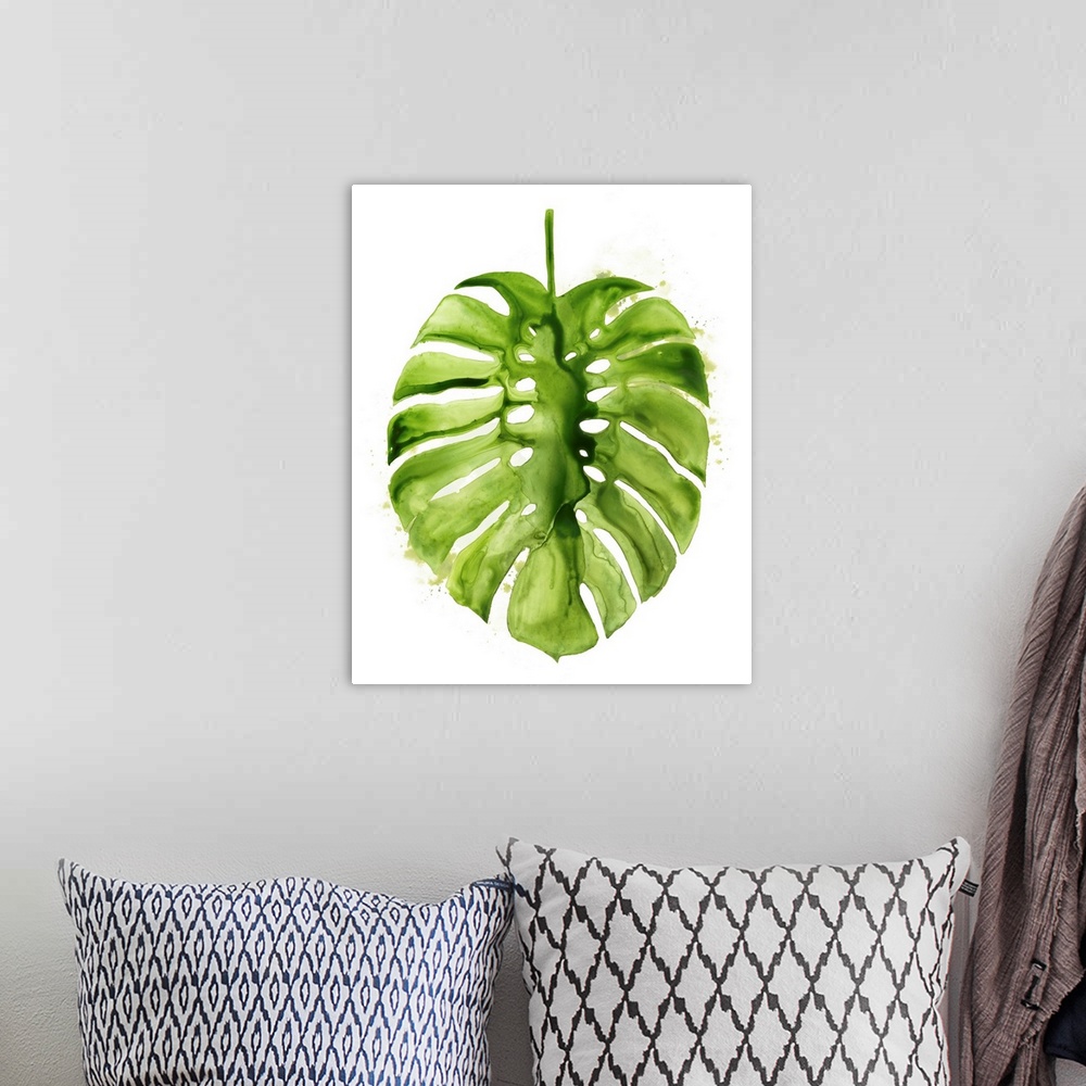 A bohemian room featuring Vibrant green broad tropical leaf on white.