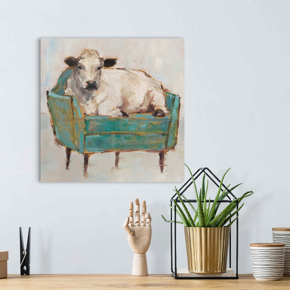A bohemian room featuring A whimsical composition of a large white cow lying comfortably on a luxe teal sofa. With it's gol...