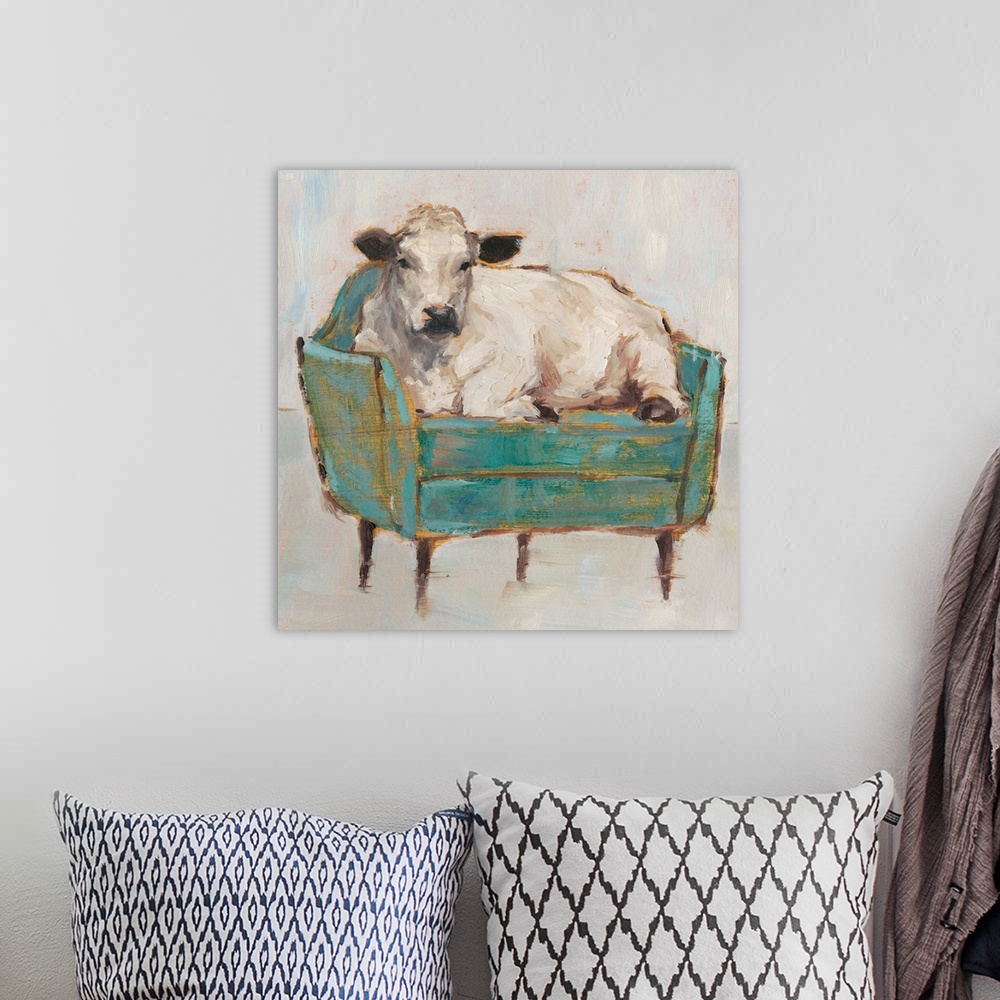 A bohemian room featuring A whimsical composition of a large white cow lying comfortably on a luxe teal sofa. With it's gol...