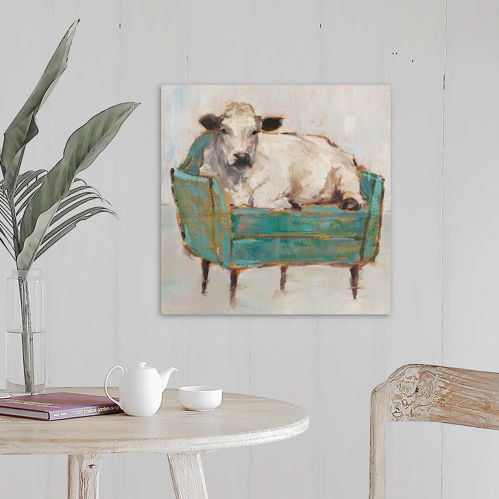 A farmhouse room featuring A whimsical composition of a large white cow lying comfortably on a luxe teal sofa. With it's gol...