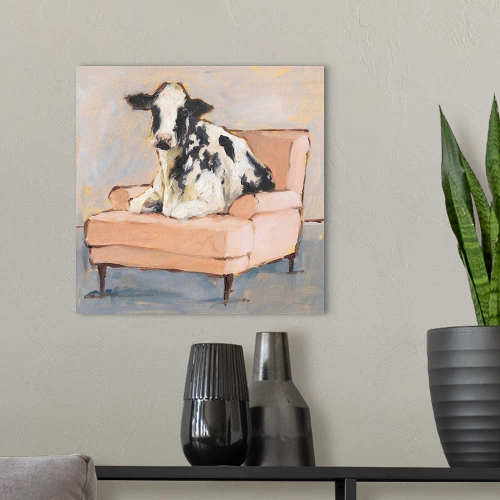 A modern room featuring A whimsical composition of a large black and white cow lying comfortably on a peach colored chais...