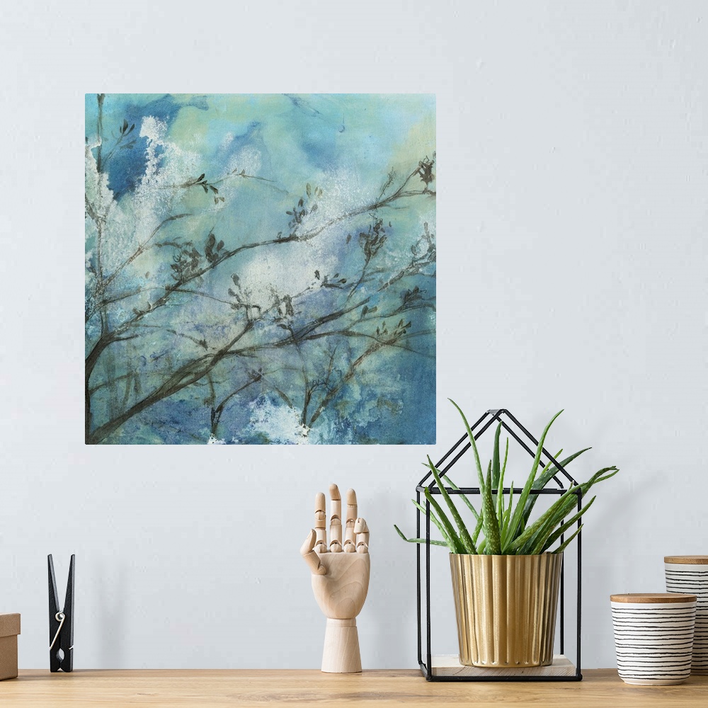 A bohemian room featuring Contemporary watercolor painting of tree branches against a blue moonlit sky.