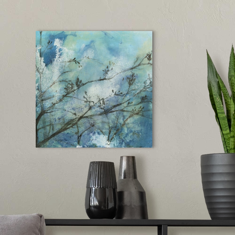 A modern room featuring Contemporary watercolor painting of tree branches against a blue moonlit sky.